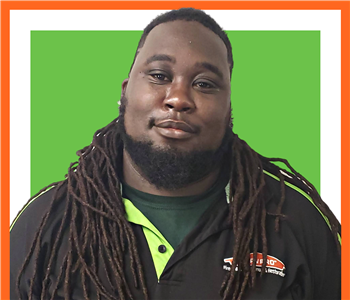 SERVPRO employee, Derrion Chatman, male in front of white background