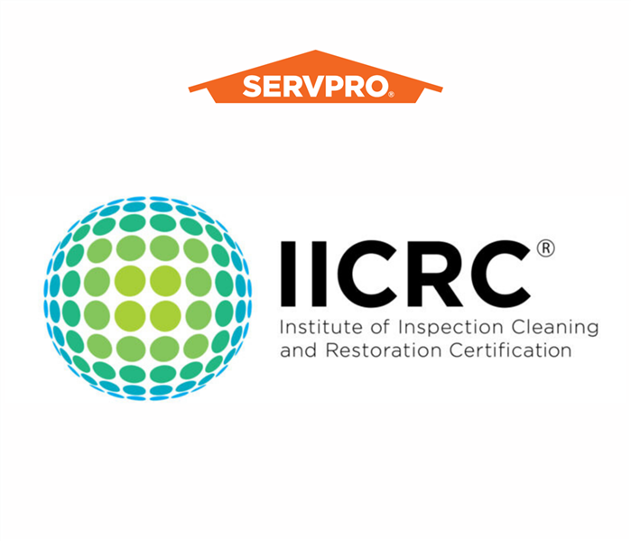 IICRC logo with dotted globe and SERVPRO orange house logo on white background